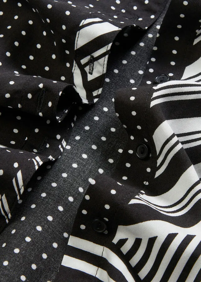 BLUSA LARGA NEGROBLANCO CON ESTAMPADO GRáFICO
