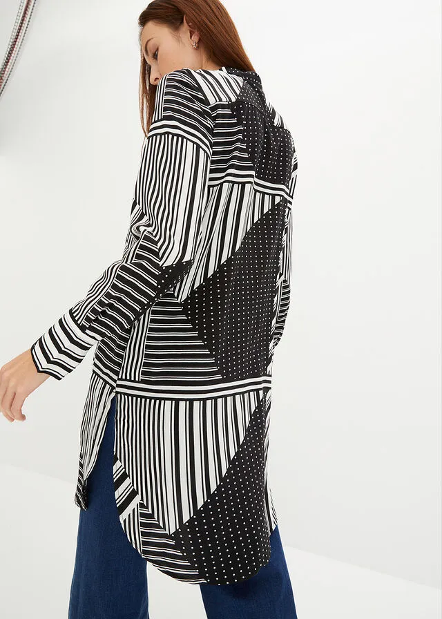 BLUSA LARGA NEGROBLANCO CON ESTAMPADO GRáFICO