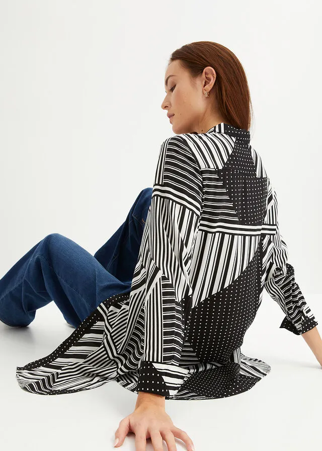 BLUSA LARGA NEGROBLANCO CON ESTAMPADO GRáFICO
