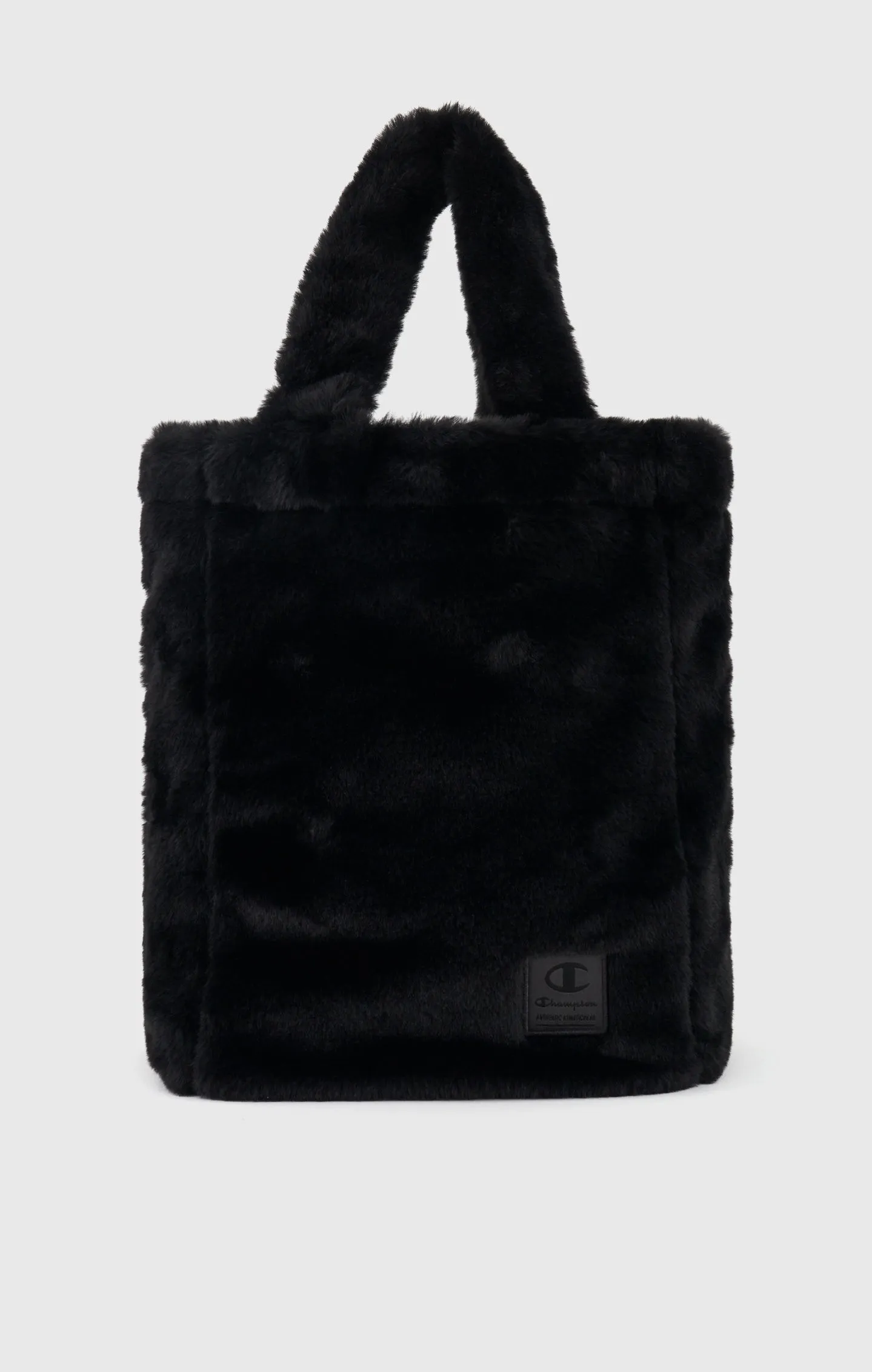 Bolso de pelo falso con etiqueta de jacquard