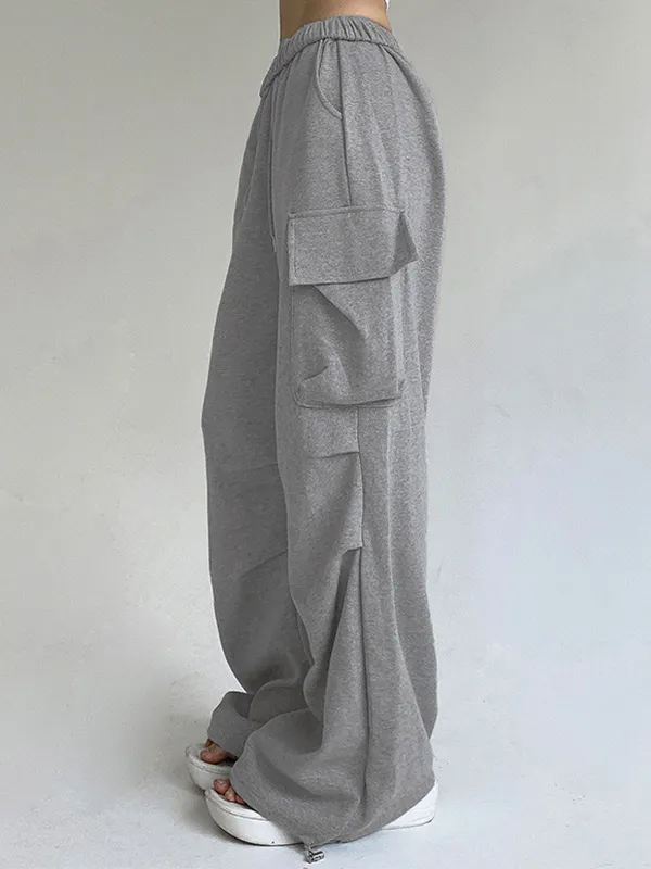 Pantalones deportivos plisados con bolsillo de color liso