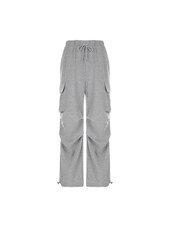 Pantalones deportivos plisados con bolsillo de color liso