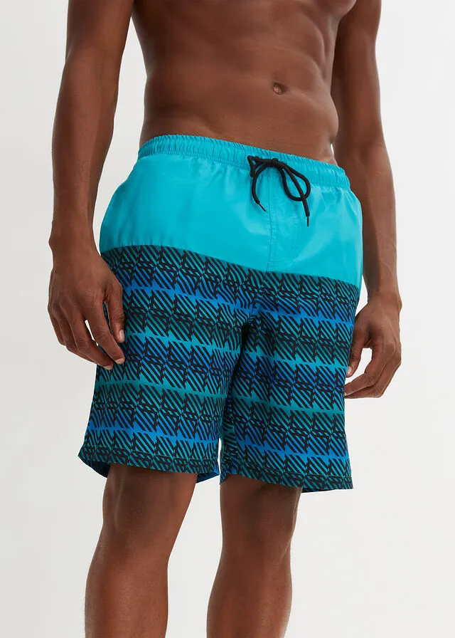 PANTALóN CORTO DE PLAYA TURQUESANEGRO CON ESTAMPADO GRáFICO