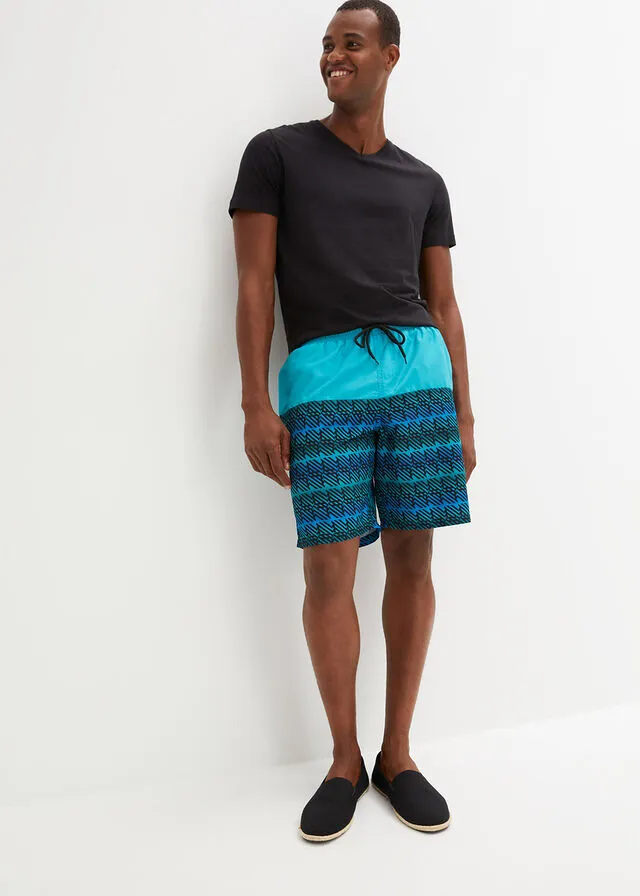 PANTALóN CORTO DE PLAYA TURQUESANEGRO CON ESTAMPADO GRáFICO