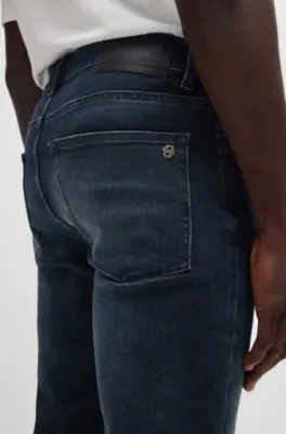 Vaqueros Delaware slim fit en denim negro azulado flameado