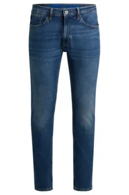 Vaqueros extra slim fit de denim elástico azul marino con lavado a la piedra