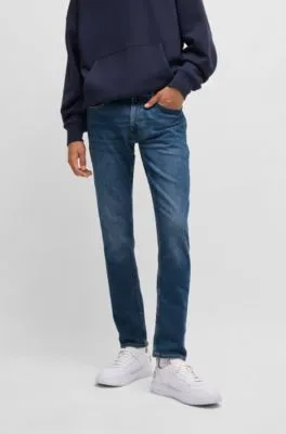 Vaqueros extra slim fit de denim elástico azul marino con lavado a la piedra