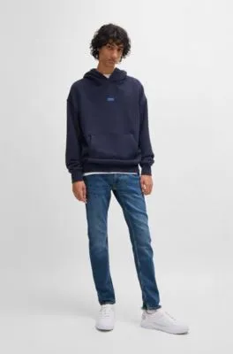 Vaqueros extra slim fit de denim elástico azul marino con lavado a la piedra