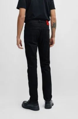 Vaqueros extra slim fit de denim elástico negro de gran comodidad