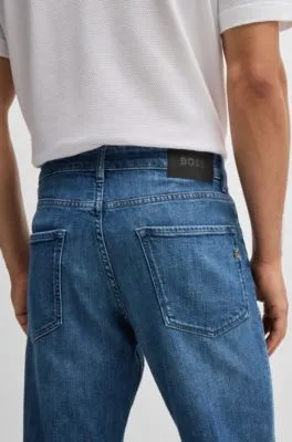 Vaqueros regular fit de denim elástico azul con estirado mecánico