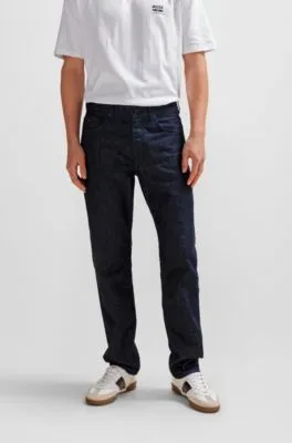 Vaqueros relaxed fit en denim rígido azul con efecto arrugado