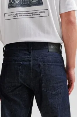 Vaqueros relaxed fit en denim rígido azul con efecto arrugado