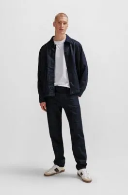 Vaqueros relaxed fit en denim rígido azul con efecto arrugado