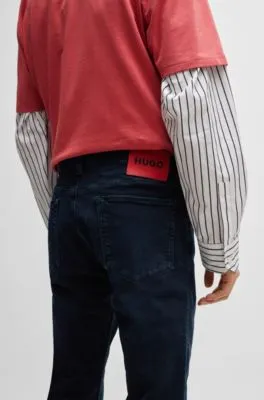 Vaqueros slim fit de denim elástico en color negro azulado