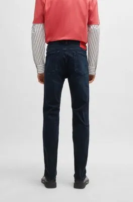 Vaqueros slim fit de denim elástico en color negro azulado