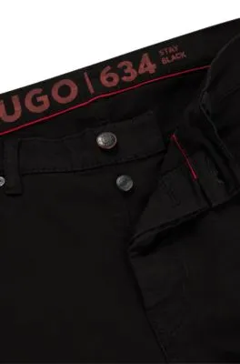 Vaqueros tapered fit de cómodo denim elástico negro