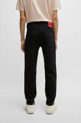 Vaqueros tapered fit de cómodo denim elástico negro
