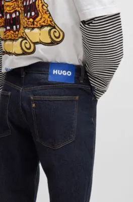 Vaqueros tapered fit de denim elástico azul oscuro