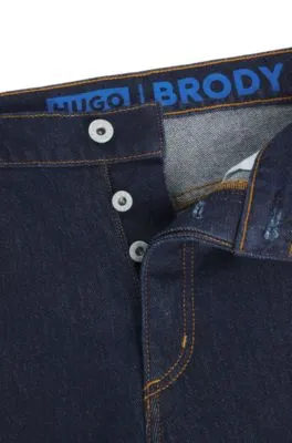 Vaqueros tapered fit de denim elástico azul oscuro