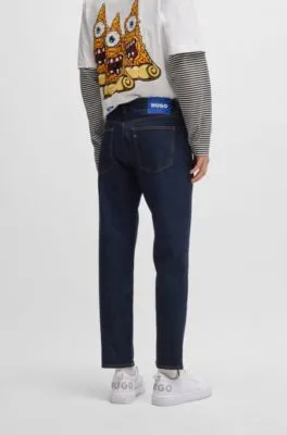 Vaqueros tapered fit de denim elástico azul oscuro
