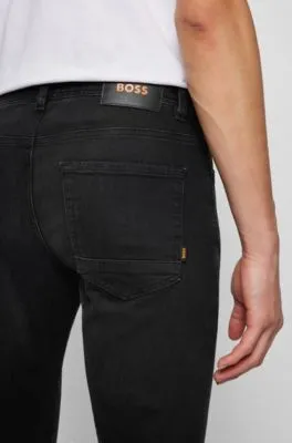 Vaqueros tapered fit de tejido vaquero superelástico en negro lavado