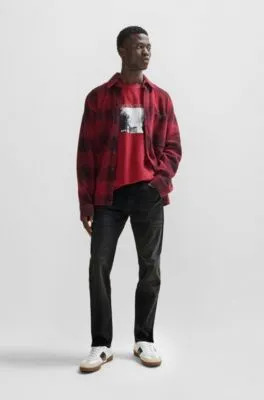 Vaqueros tapered fit de tejido vaquero supereslástico en negro